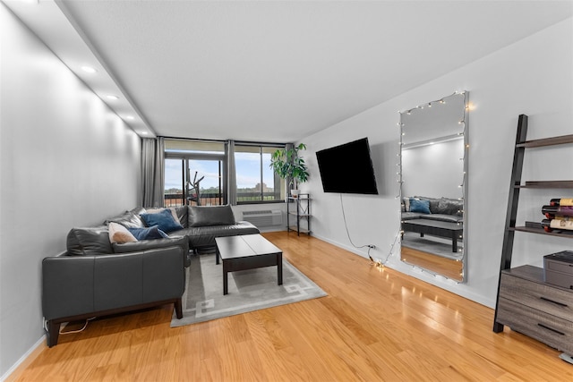 150-38 Union Tpke Unit 7R, Flushing, NY 11367 - living room featuring wood finished floors and a wall unit AC