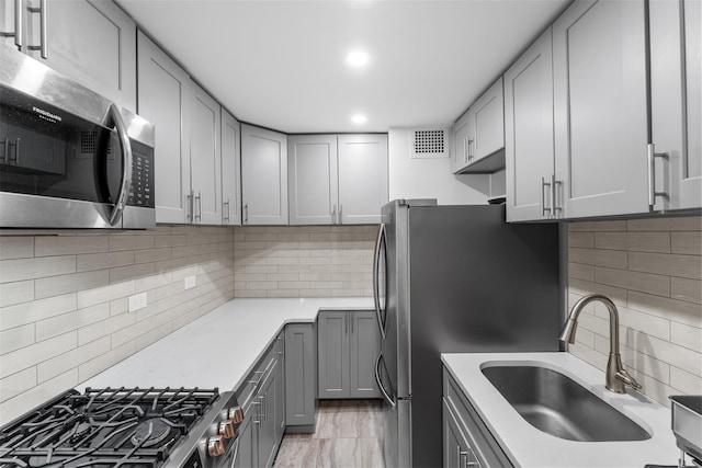 150-38 Union Tpke Unit 7R, Flushing, NY 11367 - kitchen featuring stainless steel appliances, tasteful backsplash, gray cabinets, and recessed lighting