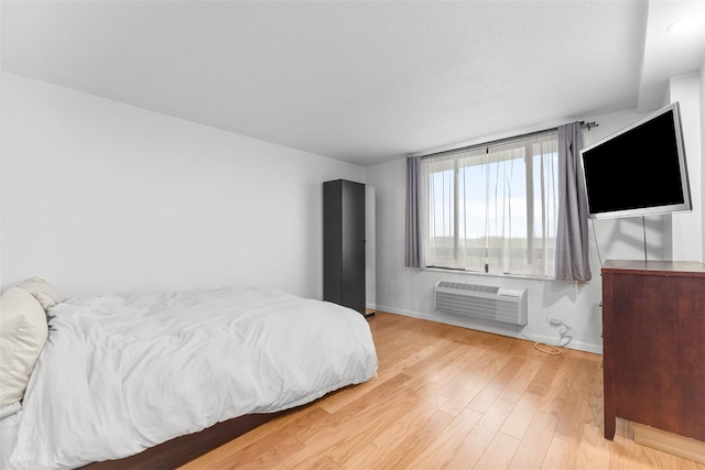 150-38 Union Tpke Unit 7R, Flushing, NY 11367 - bedroom with wood finished floors and a wall mounted AC