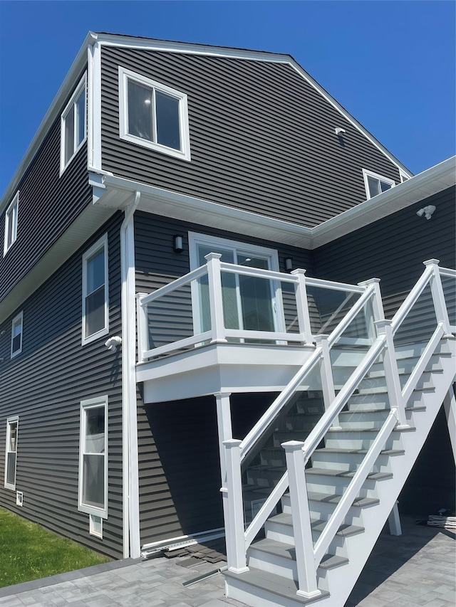 503 Nassau Ave, Freeport, NY 11520 - rear view of house featuring a patio and stairway