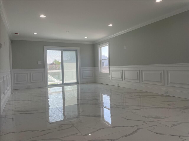 503 Nassau Ave, Freeport, NY 11520 - unfurnished room with a decorative wall, recessed lighting, marble tiled floors, crown molding, and a wainscoted wall