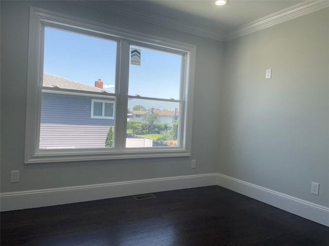 503 Nassau Ave, Freeport, NY 11520 - empty room featuring dark wood-type flooring, crown molding, and recessed lighting