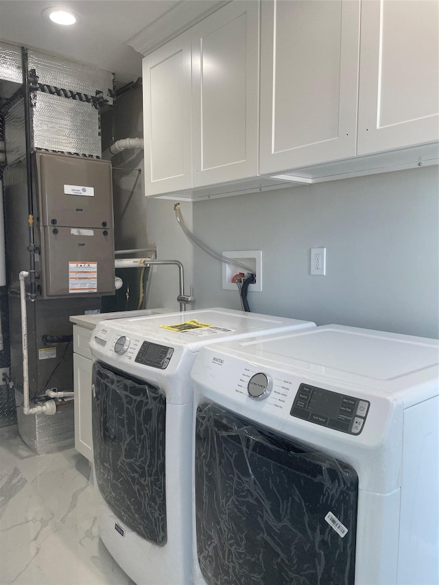 503 Nassau Ave, Freeport, NY 11520 - washroom with independent washer and dryer, light marble finish floors, and cabinet space