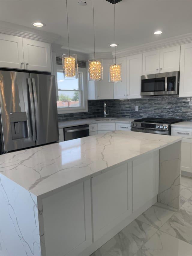 503 Nassau Ave, Freeport, NY 11520 - kitchen featuring stainless steel appliances, decorative backsplash, white cabinetry, recessed lighting, and a center island