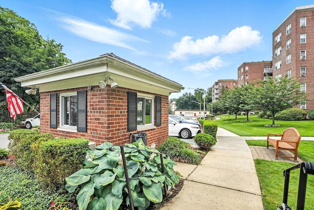 1255 N Ave Unit 2F, New Rochelle, NY 10804 - view of side of property featuring brick siding and a lawn