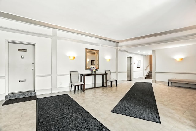 1255 N Ave Unit 2F, New Rochelle, NY 10804 - community lobby with stairs, a decorative wall, and crown molding