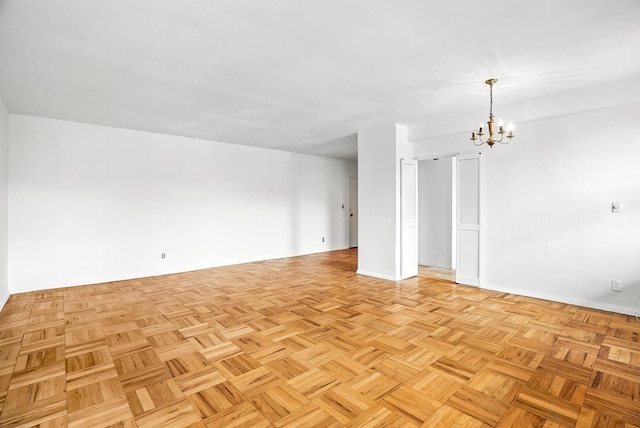 1255 N Ave Unit 2F, New Rochelle, NY 10804 - spare room featuring a chandelier and baseboards