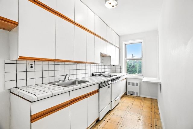 1255 N Ave Unit 2F, New Rochelle, NY 10804 - kitchen featuring radiator, white appliances, white cabinets, and tile countertops