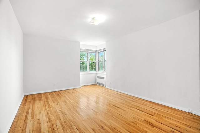 1255 N Ave Unit 2F, New Rochelle, NY 10804 - unfurnished room with radiator heating unit and light wood finished floors