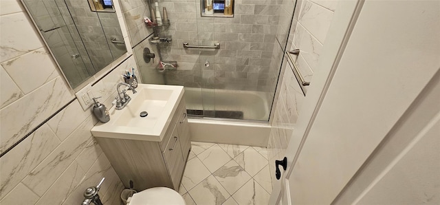 3344 Junction Blvd Unit 2X, Jackson Heights, NY 11372 - full bathroom featuring vanity, tile walls, and bath / shower combo with glass door
