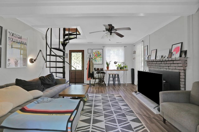 525 Myrtle Ave, Gardiner, NY 12589 - living room featuring stairway, wood finished floors, ceiling fan, and a brick fireplace