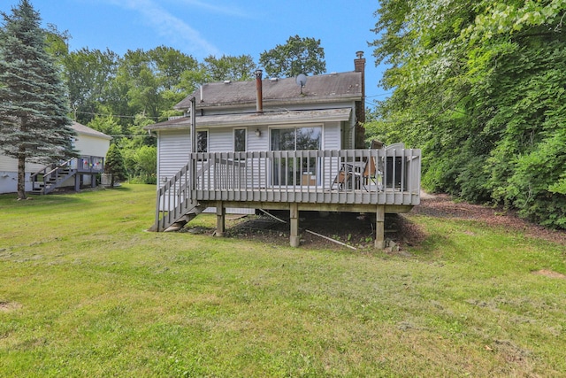 525 Myrtle Ave, Gardiner, NY 12589 - rear view of house with a chimney, a yard, a wooden deck, and stairway
