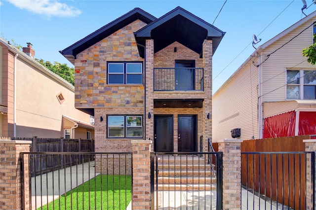89-25 127th St, Richmond Hill, NY 11418 - view of front of house featuring a balcony, a fenced front yard, a gate, and brick siding