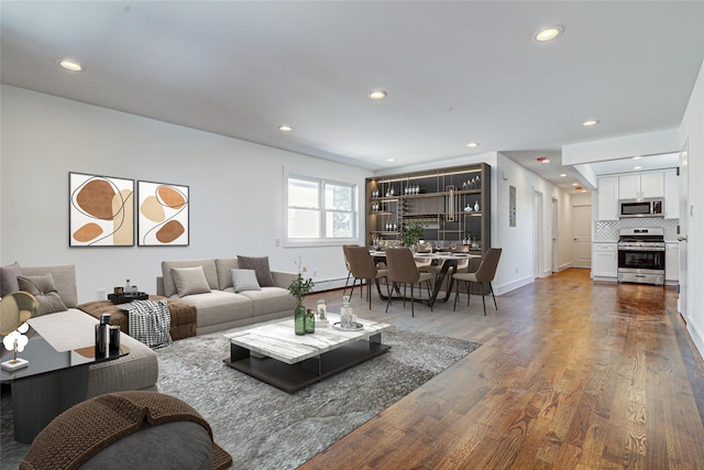 89-25 127th St, Richmond Hill, NY 11418 - living area featuring wood finished floors and recessed lighting