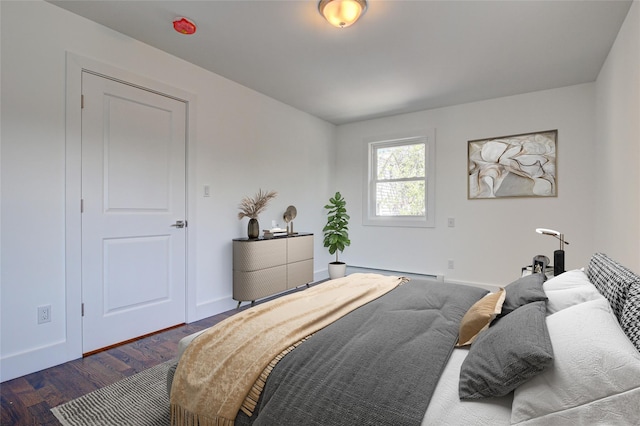 89-25 127th St, Richmond Hill, NY 11418 - bedroom with a baseboard radiator and dark wood-style floors