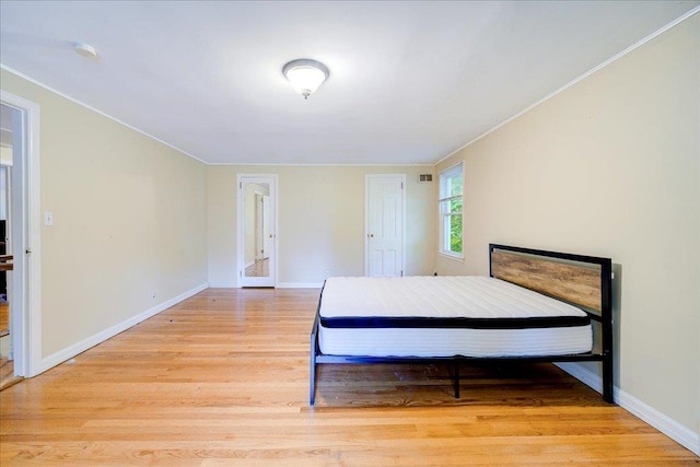 17 Seaman Rd, Poughkeepsie, NY 12601 - bedroom featuring light wood-style flooring and ornamental molding