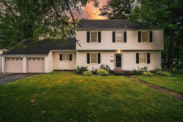 17 Seaman Rd, Poughkeepsie, NY 12601 - colonial home with an attached garage, driveway, and a lawn