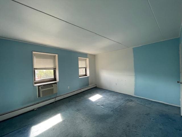 100 Clinton Ave Unit 3P, Mineola, NY 11501 - empty room with carpet, a baseboard heating unit, and an AC wall unit