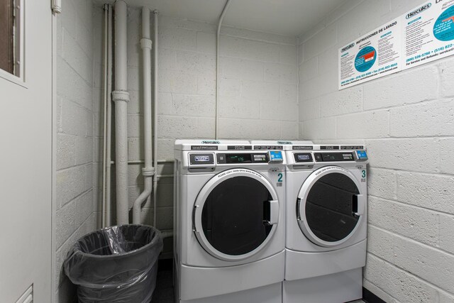 100 Clinton Ave Unit 3P, Mineola, NY 11501 - shared laundry with independent washer and dryer and concrete block wall