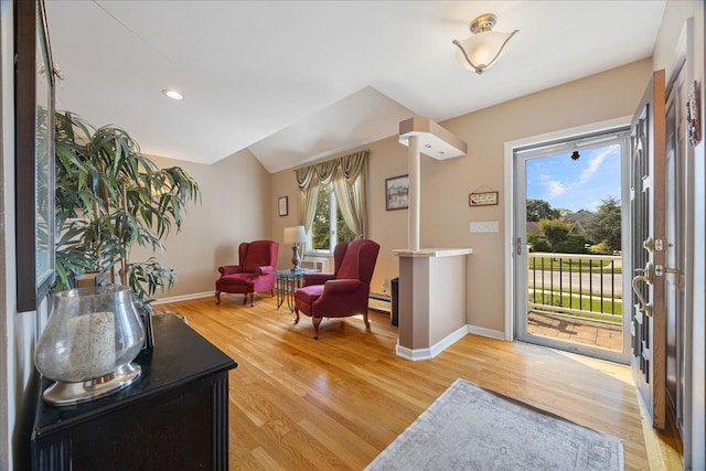 17 Acorn Rd, East Rockaway, NY 11518 - foyer entrance with light wood-type flooring and a baseboard heating unit