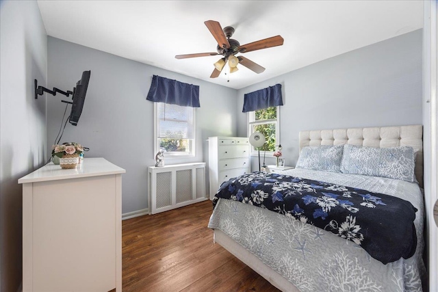 17 Acorn Rd, East Rockaway, NY 11518 - bedroom with radiator heating unit, wood finished floors, and a ceiling fan