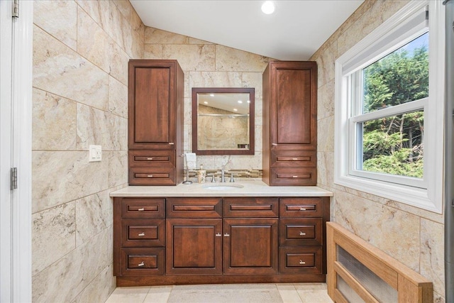 17 Acorn Rd, East Rockaway, NY 11518 - bathroom with vanity, tile walls, lofted ceiling, and a shower