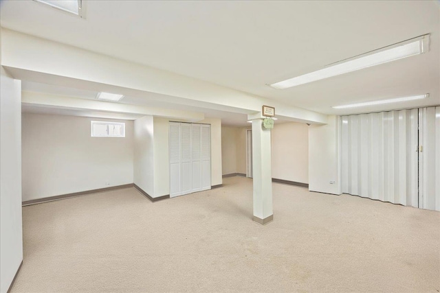 17 Acorn Rd, East Rockaway, NY 11518 - below grade area featuring light colored carpet and baseboards