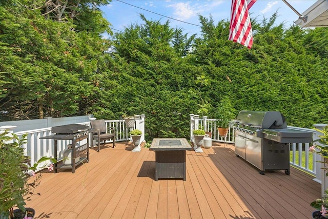 17 Acorn Rd, East Rockaway, NY 11518 - deck with a fire pit and grilling area