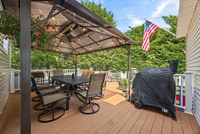 17 Acorn Rd, East Rockaway, NY 11518 - wooden deck with a gazebo, outdoor dining area, and a grill