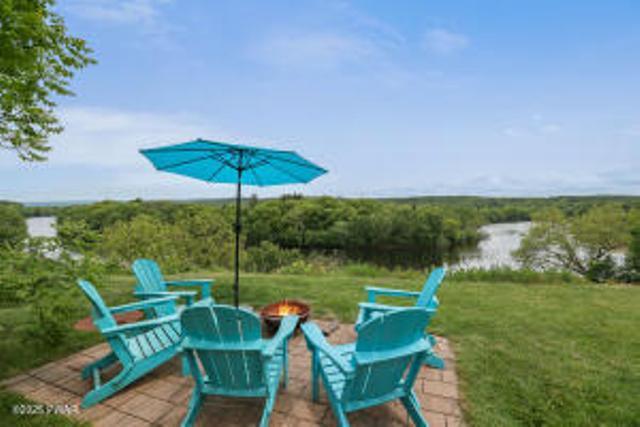 312 E Ann St, Milford, PA 18337 - view of patio featuring a fire pit and a view of trees