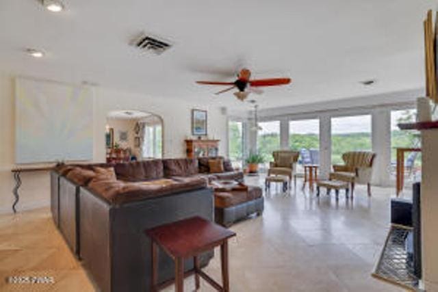312 E Ann St, Milford, PA 18337 - living area featuring ceiling fan and arched walkways