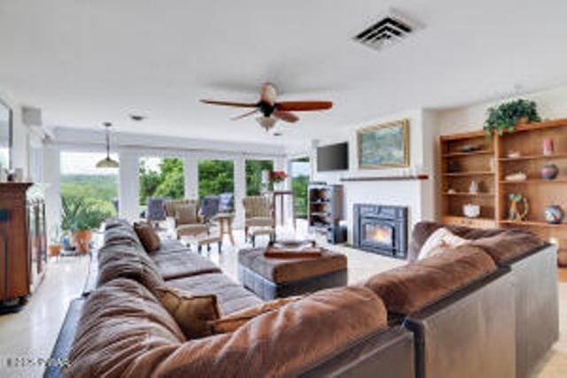 312 E Ann St, Milford, PA 18337 - living room with a lit fireplace and a ceiling fan