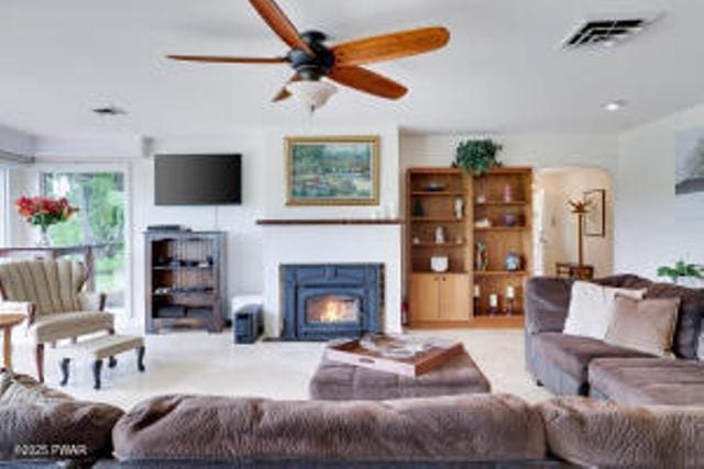 312 E Ann St, Milford, PA 18337 - living area featuring a ceiling fan and a warm lit fireplace