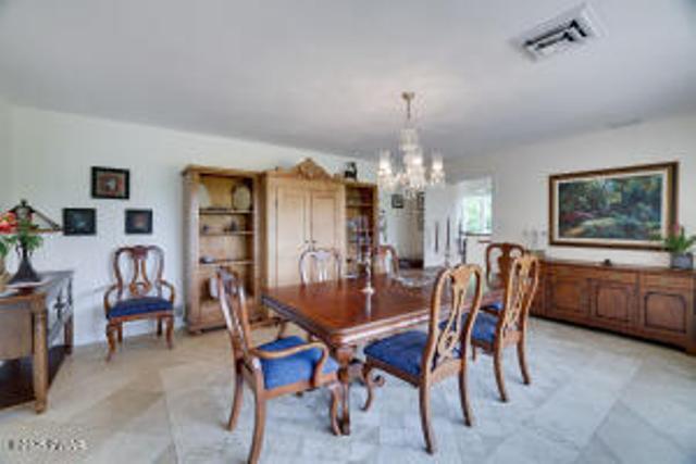 312 E Ann St, Milford, PA 18337 - dining space featuring a chandelier