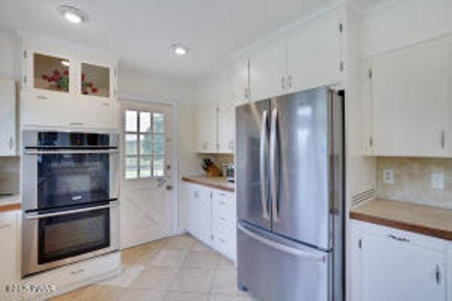 312 E Ann St, Milford, PA 18337 - kitchen with stainless steel appliances, white cabinets, and light countertops