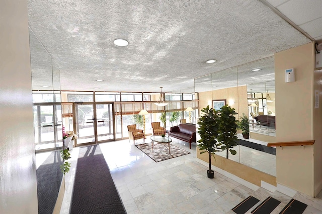 85 S Centre Ave Unit A17, Rockville Centre, NY 11570 - common area featuring a textured ceiling and expansive windows