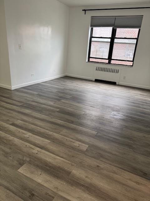 44-16 Macnish St Unit 5B, Elmhurst, NY 11373 - unfurnished room with radiator and dark wood-type flooring