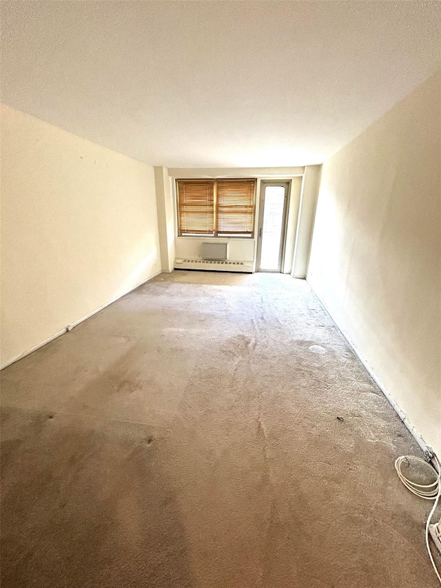81-11 45th Ave Unit 3, Elmhurst, NY 11373 - unfurnished living room with carpet flooring