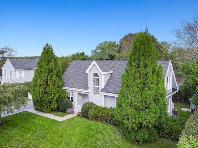 91 Howell St, Southampton, NY 11968 - view of front of property with roof with shingles and a front lawn