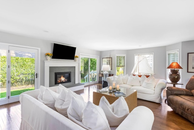 91 Howell St, Southampton, NY 11968 - living area featuring a glass covered fireplace and wood finished floors