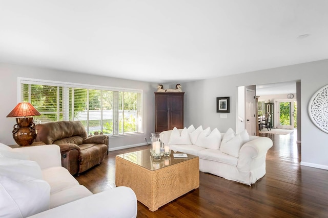 91 Howell St, Southampton, NY 11968 - living area with dark wood-style flooring and baseboards