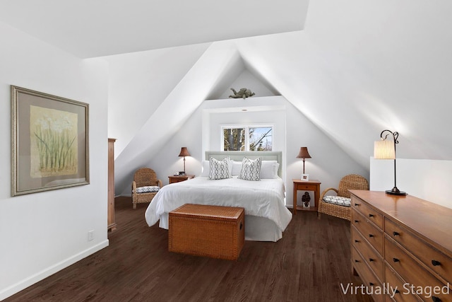 91 Howell St, Southampton, NY 11968 - bedroom featuring dark wood-style flooring and vaulted ceiling