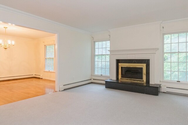 2 Demarest Rd, Chestnut Ridge, NY 10977 - unfurnished living room with carpet floors, a chandelier, crown molding, plenty of natural light, and a high end fireplace
