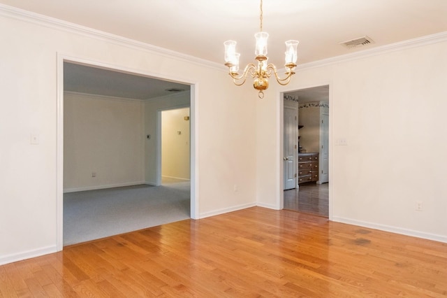 2 Demarest Rd, Chestnut Ridge, NY 10977 - spare room with a chandelier, crown molding, and light wood-style flooring