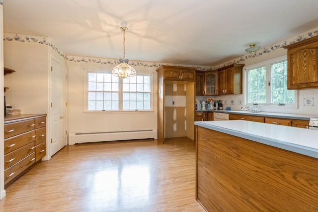 2 Demarest Rd, Chestnut Ridge, NY 10977 - kitchen featuring baseboard heating, brown cabinets, light wood-type flooring, and a chandelier