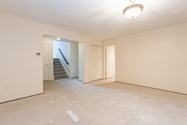2 Demarest Rd, Chestnut Ridge, NY 10977 - empty room featuring stairway and unfinished concrete flooring