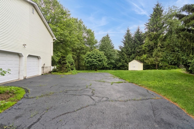 2 Demarest Rd, Chestnut Ridge, NY 10977 - view of patio / terrace with a storage shed, a garage, and driveway