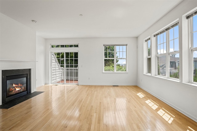 402 Waterview Dr, Poughkeepsie, NY 12601 - unfurnished living room with a fireplace with flush hearth and wood-type flooring