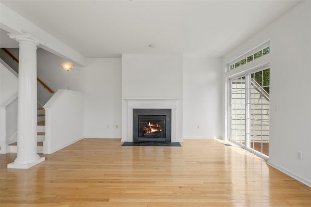 402 Waterview Dr, Poughkeepsie, NY 12601 - unfurnished living room with light wood finished floors, stairway, and a fireplace with flush hearth