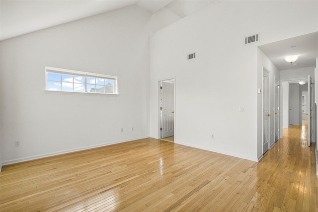 402 Waterview Dr, Poughkeepsie, NY 12601 - spare room featuring high vaulted ceiling and light wood-type flooring